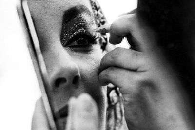 Liz touching up makeup cleo